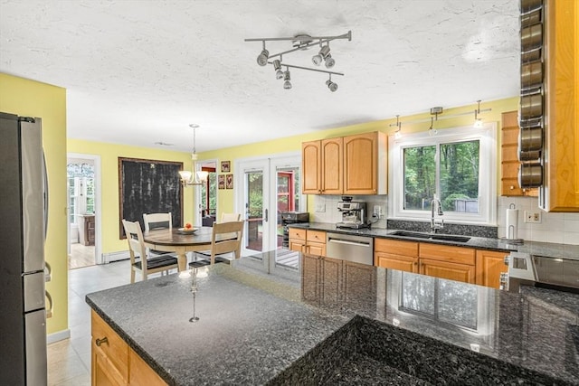 31 Alexander Rd, Hopkinton, MA 01748 - kitchen with a sink, appliances with stainless steel finishes, healthy amount of natural light, a textured ceiling, and dark stone countertops