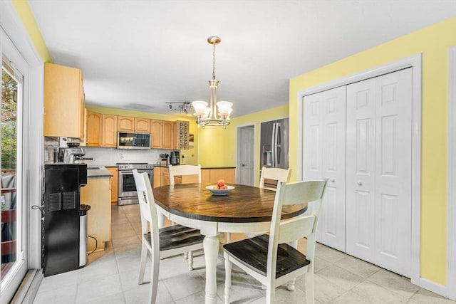 31 Alexander Rd, Hopkinton, MA 01748 - dining area with a chandelier and light tile patterned flooring