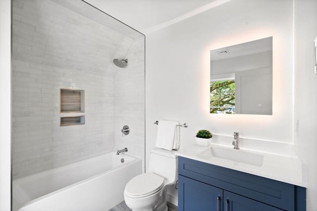 bathroom with toilet, vanity, and washtub / shower combination
