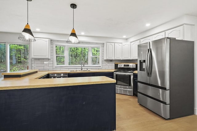 455 Main St, Rutland, MA 01543 - kitchen with stainless steel appliances, a sink, plenty of natural light, a peninsula, and recessed lighting