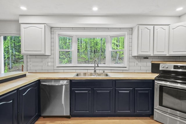 455 Main St, Rutland, MA 01543 - kitchen with stainless steel appliances, a sink, butcher block counters, healthy amount of natural light, and recessed lighting