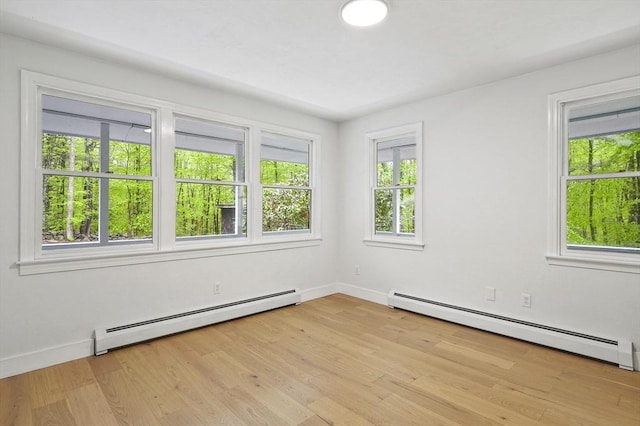 455 Main St, Rutland, MA 01543 - spare room with baseboard heating, baseboards, and light wood-type flooring