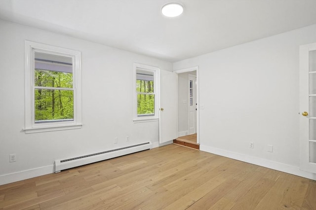 455 Main St, Rutland, MA 01543 - spare room featuring a baseboard heating unit, light wood finished floors, and baseboards
