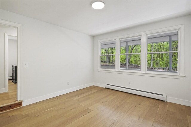 455 Main St, Rutland, MA 01543 - empty room featuring baseboard heating, light wood-type flooring, and baseboards