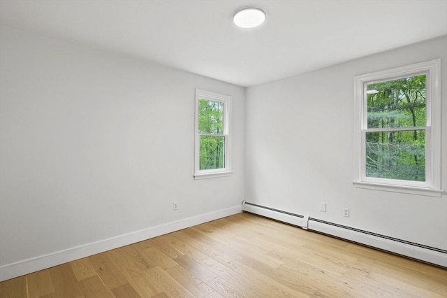 455 Main St, Rutland, MA 01543 - unfurnished room with a baseboard radiator, light wood-type flooring, and baseboards