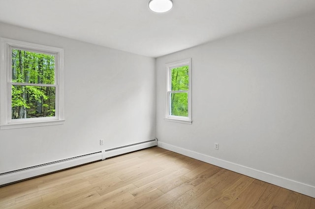 455 Main St, Rutland, MA 01543 - spare room featuring a baseboard radiator, baseboards, healthy amount of natural light, and light wood-type flooring