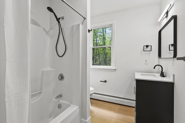 455 Main St, Rutland, MA 01543 - full bathroom featuring a baseboard radiator, wood finished floors, toilet, vanity, and shower / tub combo