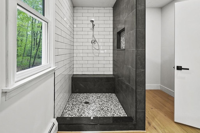 455 Main St, Rutland, MA 01543 - full bathroom with tiled shower, wood finished floors, and baseboards
