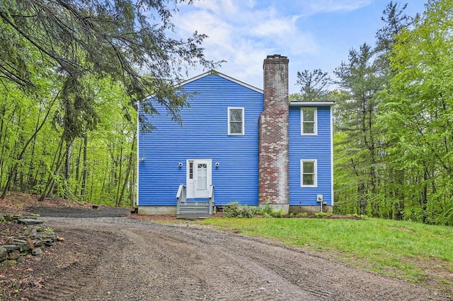 455 Main St, Rutland, MA 01543 - view of front of house featuring a chimney, entry steps, and driveway