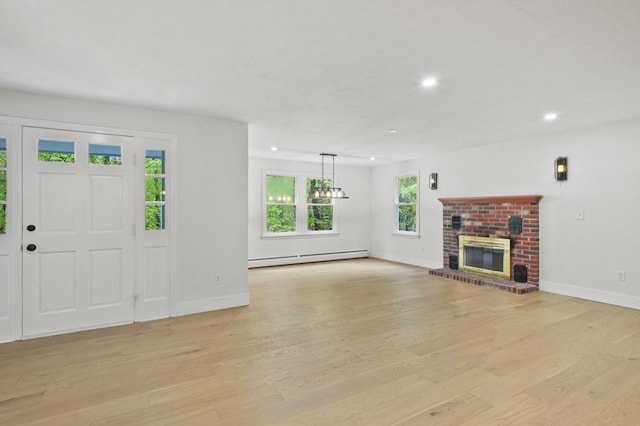 455 Main St, Rutland, MA 01543 - unfurnished living room featuring baseboard heating, recessed lighting, baseboards, light wood-style floors, and a fireplace