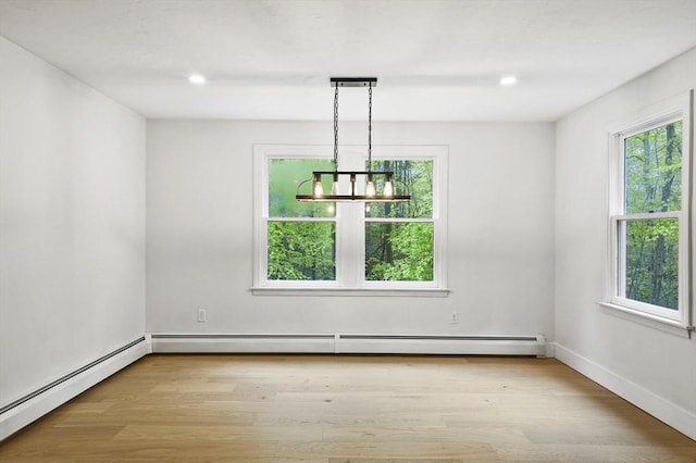 455 Main St, Rutland, MA 01543 - unfurnished room featuring healthy amount of natural light, a chandelier, wood finished floors, a baseboard heating unit, and recessed lighting