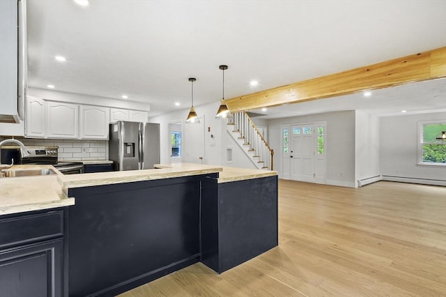 455 Main St, Rutland, MA 01543 - kitchen featuring stainless steel appliances, a sink, recessed lighting, white cabinets, and healthy amount of natural light