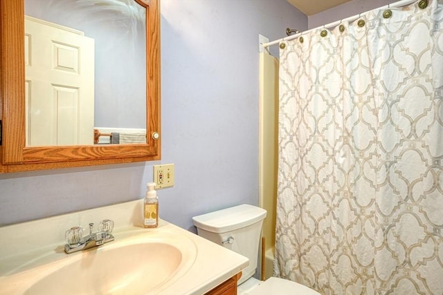 full bathroom with shower / bathtub combination with curtain, vanity, and toilet