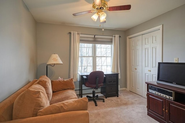 carpeted office with ceiling fan and a baseboard radiator