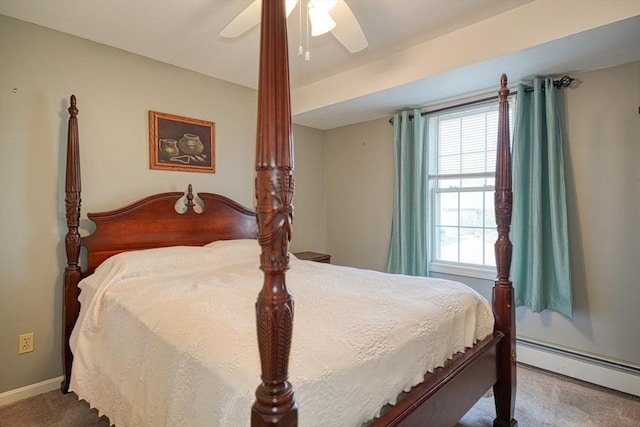 carpeted bedroom featuring ceiling fan and a baseboard heating unit