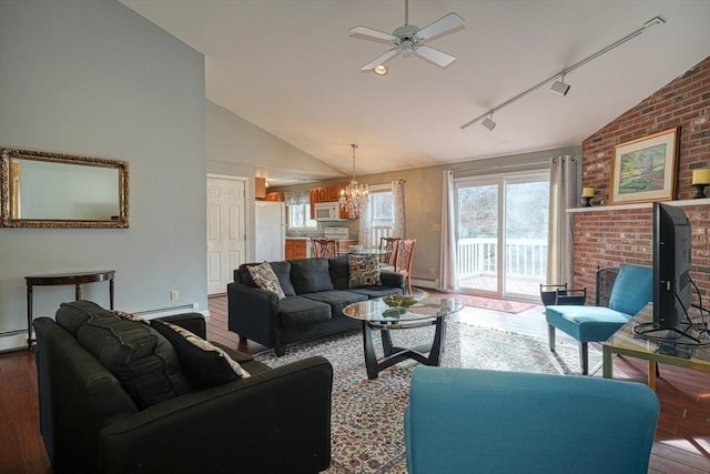 living room with ceiling fan with notable chandelier, hardwood / wood-style floors, rail lighting, and lofted ceiling