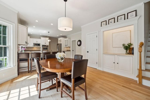 20 October Dr, Franklin, MA 02038 - dining space with crown molding, plenty of natural light, light wood-type flooring, recessed lighting, and stairs