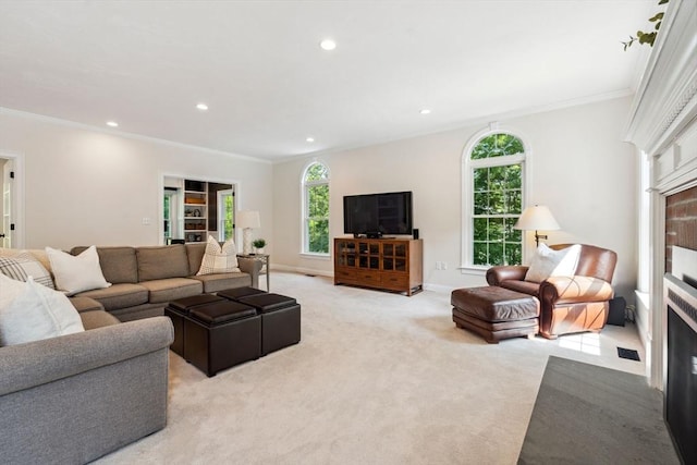 20 October Dr, Franklin, MA 02038 - living area with light colored carpet, crown molding, and recessed lighting