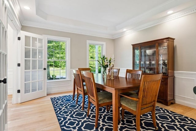 20 October Dr, Franklin, MA 02038 - dining space with light wood-style flooring, crown molding, a wainscoted wall, a tray ceiling, and a decorative wall