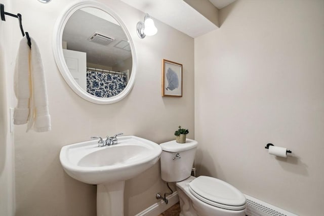 20 October Dr, Franklin, MA 02038 - bathroom with toilet and a baseboard heating unit
