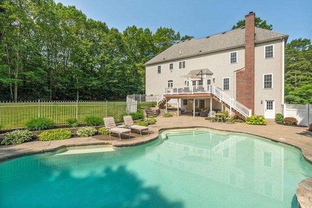20 October Dr, Franklin, MA 02038 - view of pool with stairway, a wooden deck, a fenced backyard, and a patio area