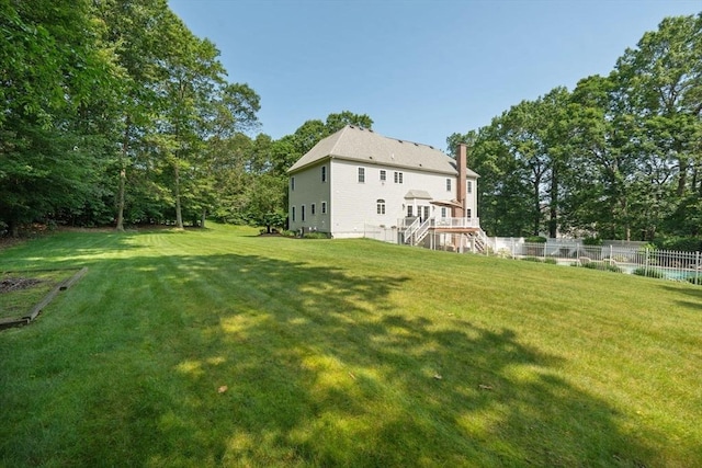 20 October Dr, Franklin, MA 02038 - back of property with stairway and a chimney