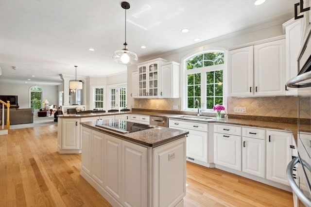 20 October Dr, Franklin, MA 02038 - kitchen featuring black electric cooktop, recessed lighting, crown molding, light wood-style floors, and a center island