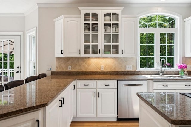 20 October Dr, Franklin, MA 02038 - kitchen with dishwasher, glass insert cabinets, dark stone countertops, crown molding, and plenty of natural light