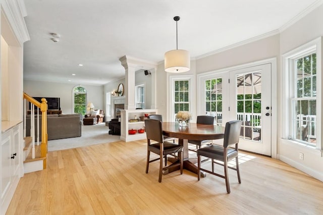 20 October Dr, Franklin, MA 02038 - dining space featuring a fireplace, light wood-style flooring, plenty of natural light, ornamental molding, and recessed lighting