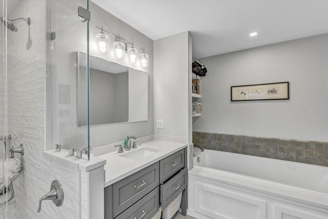 bathroom with vanity, a bath, recessed lighting, and a stall shower