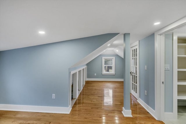 bonus room with recessed lighting, baseboards, wood finished floors, and vaulted ceiling