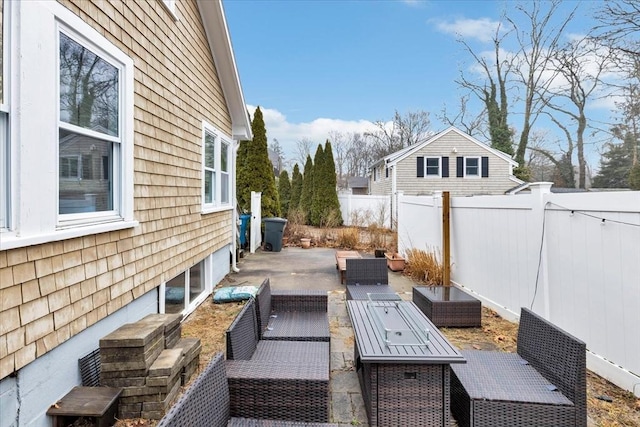 view of patio with an outdoor hangout area and fence private yard