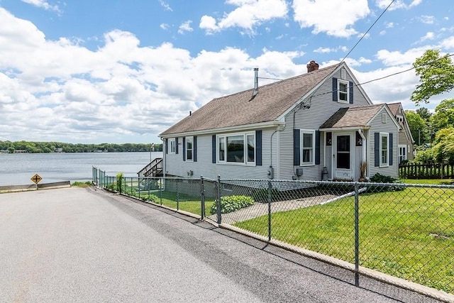 4 Lake Ave, Tiverton, RI 02878 - bungalow-style home featuring a water view, a chimney, and roof with shingles