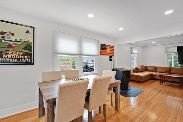 dining room featuring light wood-type flooring, recessed lighting, and baseboards