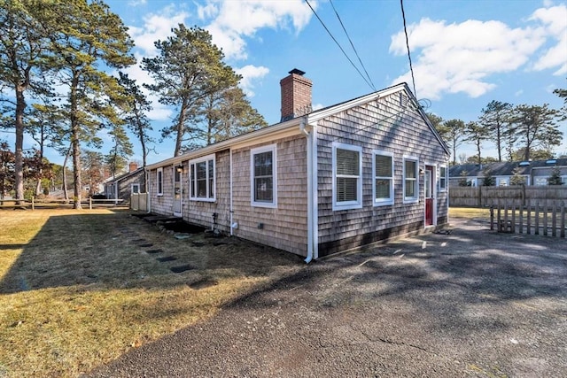 view of home's exterior with a lawn