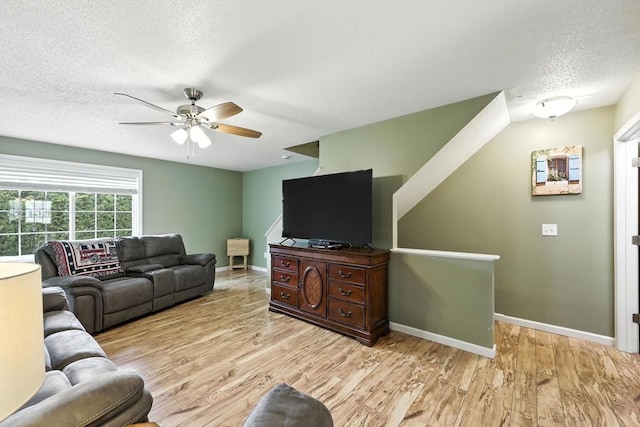50 Waters Edge Unit 50, Ludlow, MA 01056 - living room featuring a textured ceiling, a ceiling fan, and light wood-type flooring