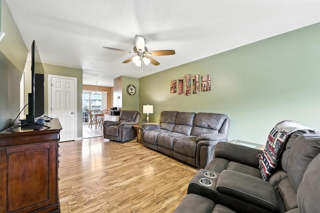 50 Waters Edge Unit 50, Ludlow, MA 01056 - living room with ceiling fan, light wood-style floors, and a textured ceiling