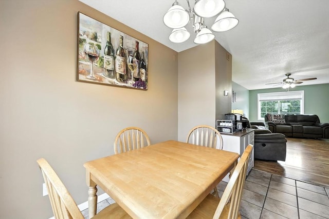 50 Waters Edge Unit 50, Ludlow, MA 01056 - dining space featuring a chandelier, a ceiling fan, and light tile patterned flooring