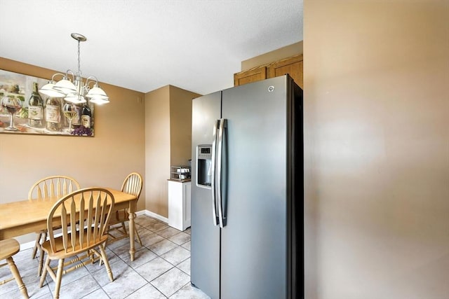 50 Waters Edge Unit 50, Ludlow, MA 01056 - dining space with a chandelier and light tile patterned floors