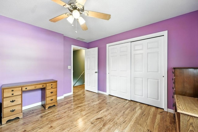 50 Waters Edge Unit 50, Ludlow, MA 01056 - unfurnished bedroom with light wood-style flooring, a ceiling fan, and a closet