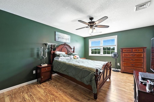 50 Waters Edge Unit 50, Ludlow, MA 01056 - bedroom with a textured ceiling, light wood-type flooring, and ceiling fan