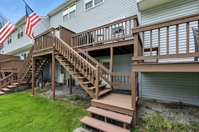 50 Waters Edge Unit 50, Ludlow, MA 01056 - rear view of house featuring stairway, a deck, and a yard