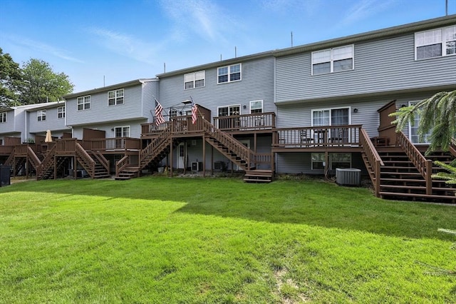 50 Waters Edge Unit 50, Ludlow, MA 01056 - rear view of property with stairs, a wooden deck, and a yard
