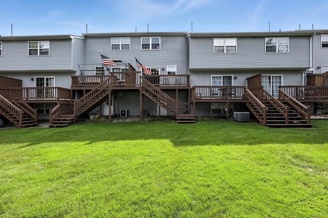 50 Waters Edge Unit 50, Ludlow, MA 01056 - rear view of house with stairway, a deck, and a lawn