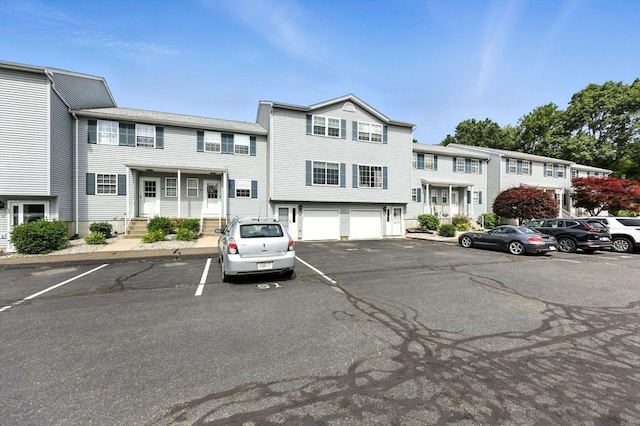 50 Waters Edge Unit 50, Ludlow, MA 01056 - view of front of house featuring uncovered parking