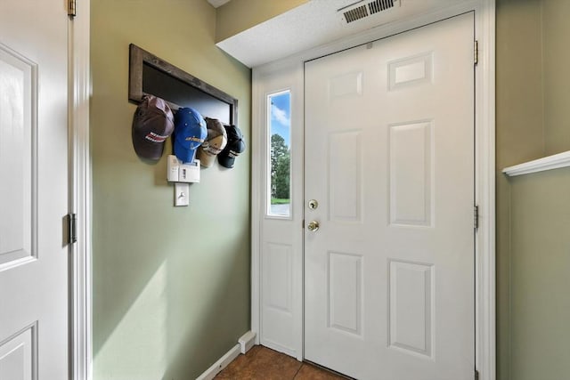 50 Waters Edge Unit 50, Ludlow, MA 01056 - entryway with baseboards and dark tile patterned floors