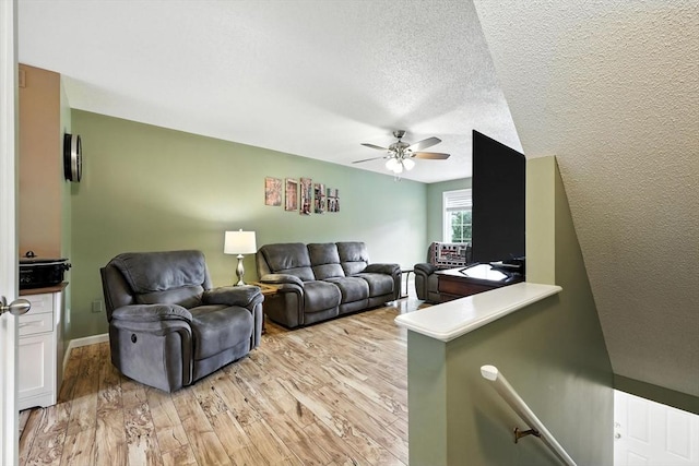 50 Waters Edge Unit 50, Ludlow, MA 01056 - living area with a ceiling fan, light wood-type flooring, and a textured ceiling