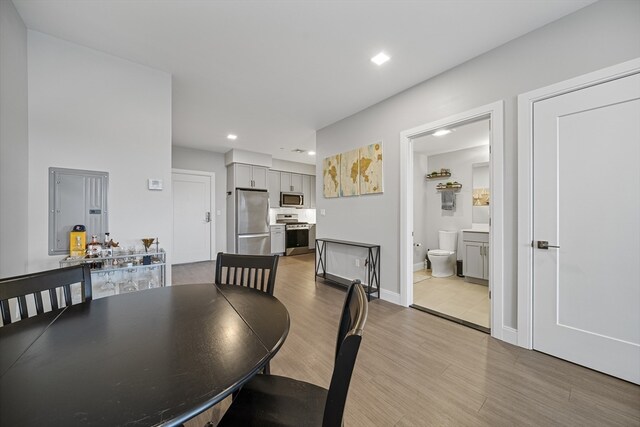 dining space with light hardwood / wood-style floors