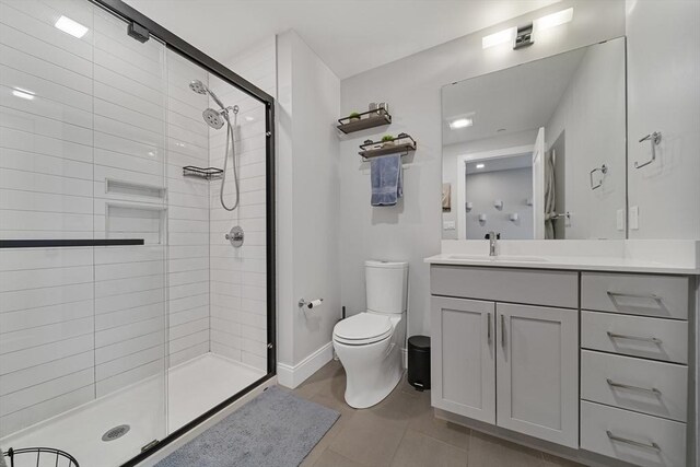 11 Walley St Unit 202, Boston, MA 02128 - full bath featuring a stall shower, toilet, vanity, tile patterned flooring, and baseboards