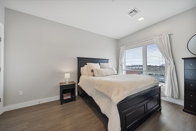 bedroom featuring dark wood-type flooring